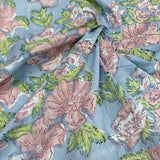 Block Print Pastel Pink Flowers with Leaves on Blue Background