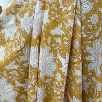 Block Print White Floral on Mustard Background