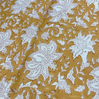 Block Print White Floral on Mustard Background